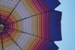 Colorful Umbrella representing Umbrella Coverage