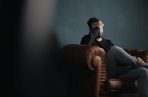 stressed man in therapist chair
